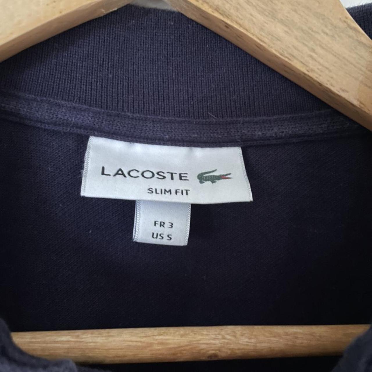 Lacoste slim fit polo shirt in navy blue, size 3... - Depop