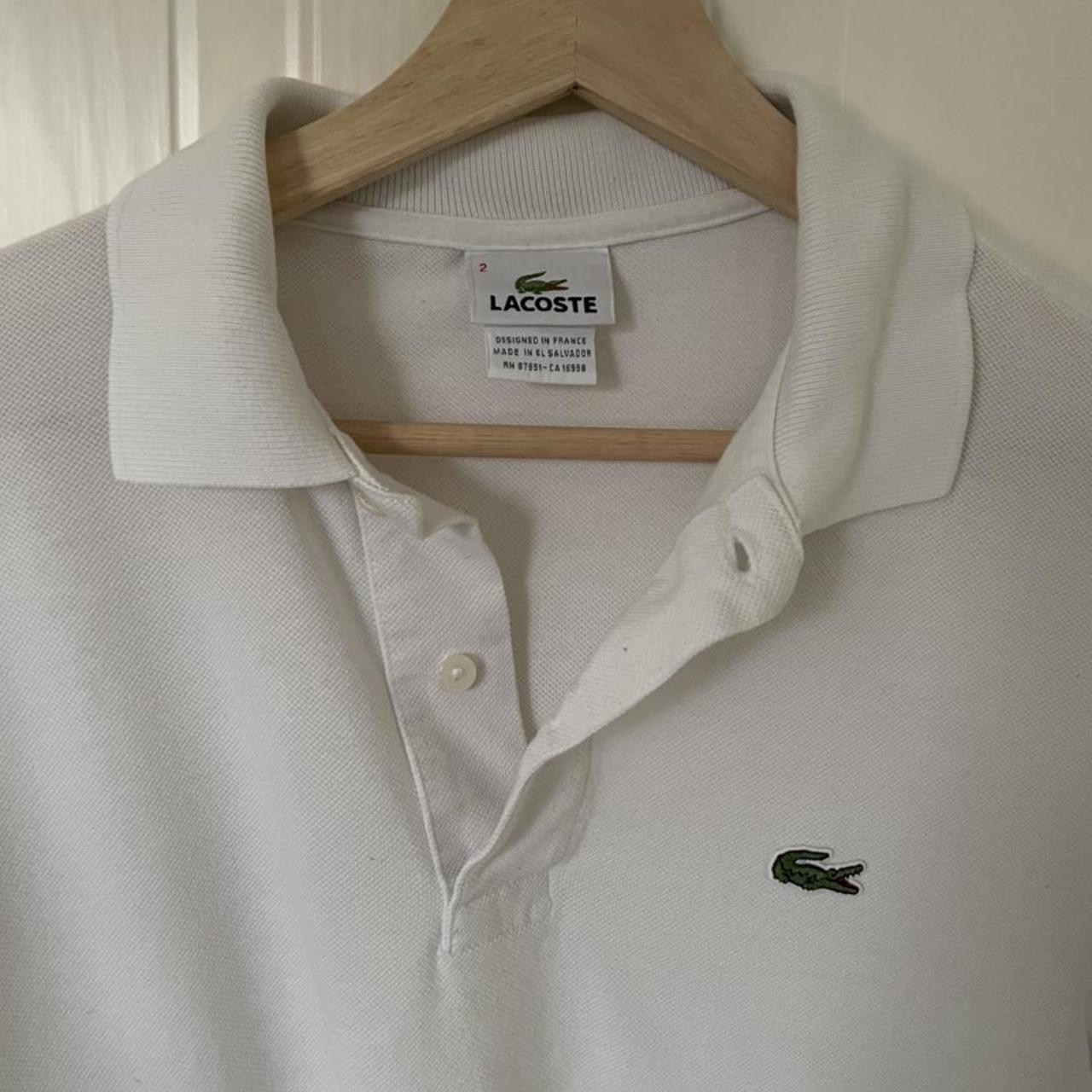 White Lacoste polo shirt in men’s size extra small,... - Depop