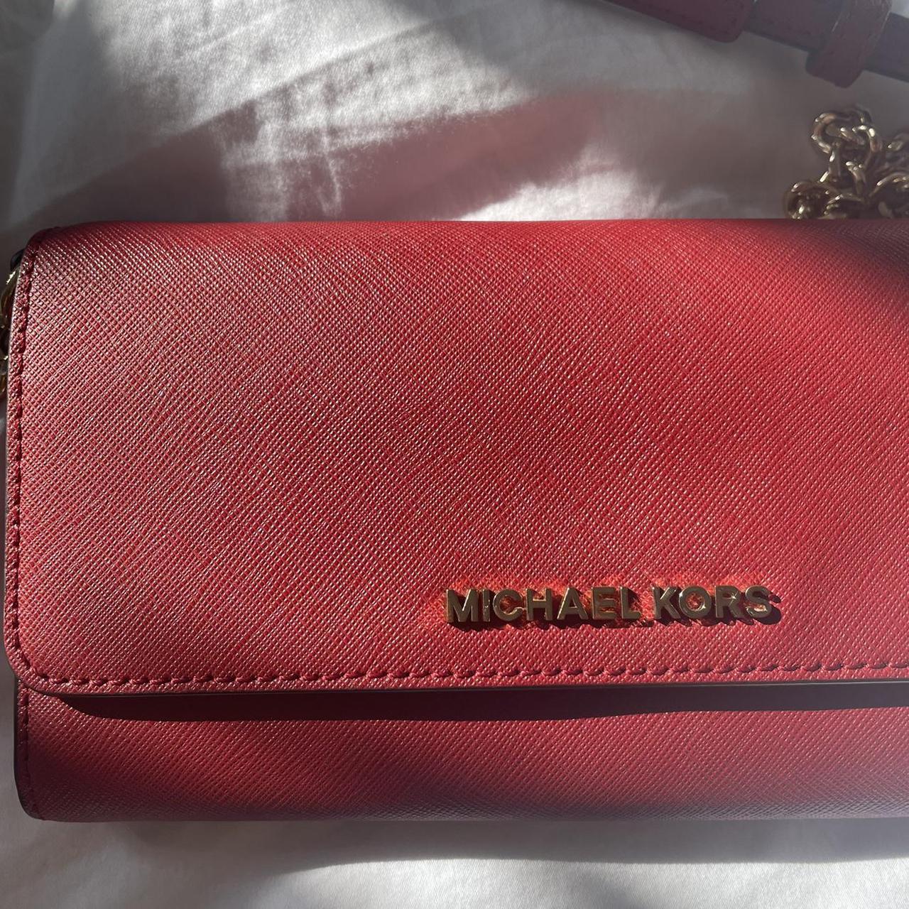 Hot pink Michael Kors wallet. Has six card holder - Depop