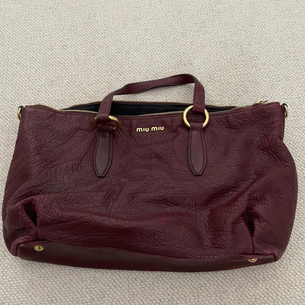 MIU MIU burgundy leather bag. Worn but excellent... - Depop