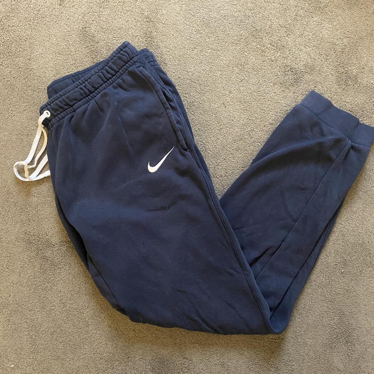 Navy Nike joggers White embroidered logo Two small... Depop