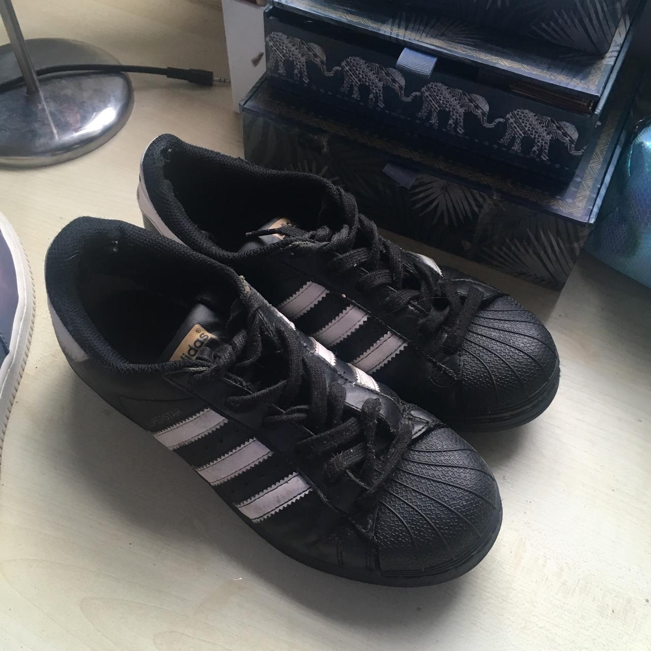 Adidas superstars black and white some wear in them... - Depop