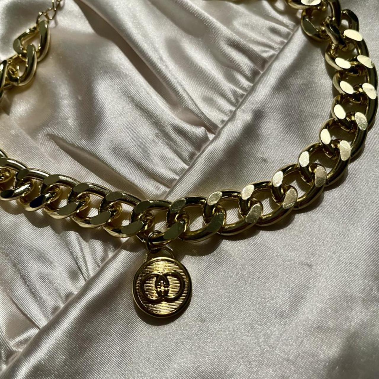 gold Gucci button repurposed into a... Depop