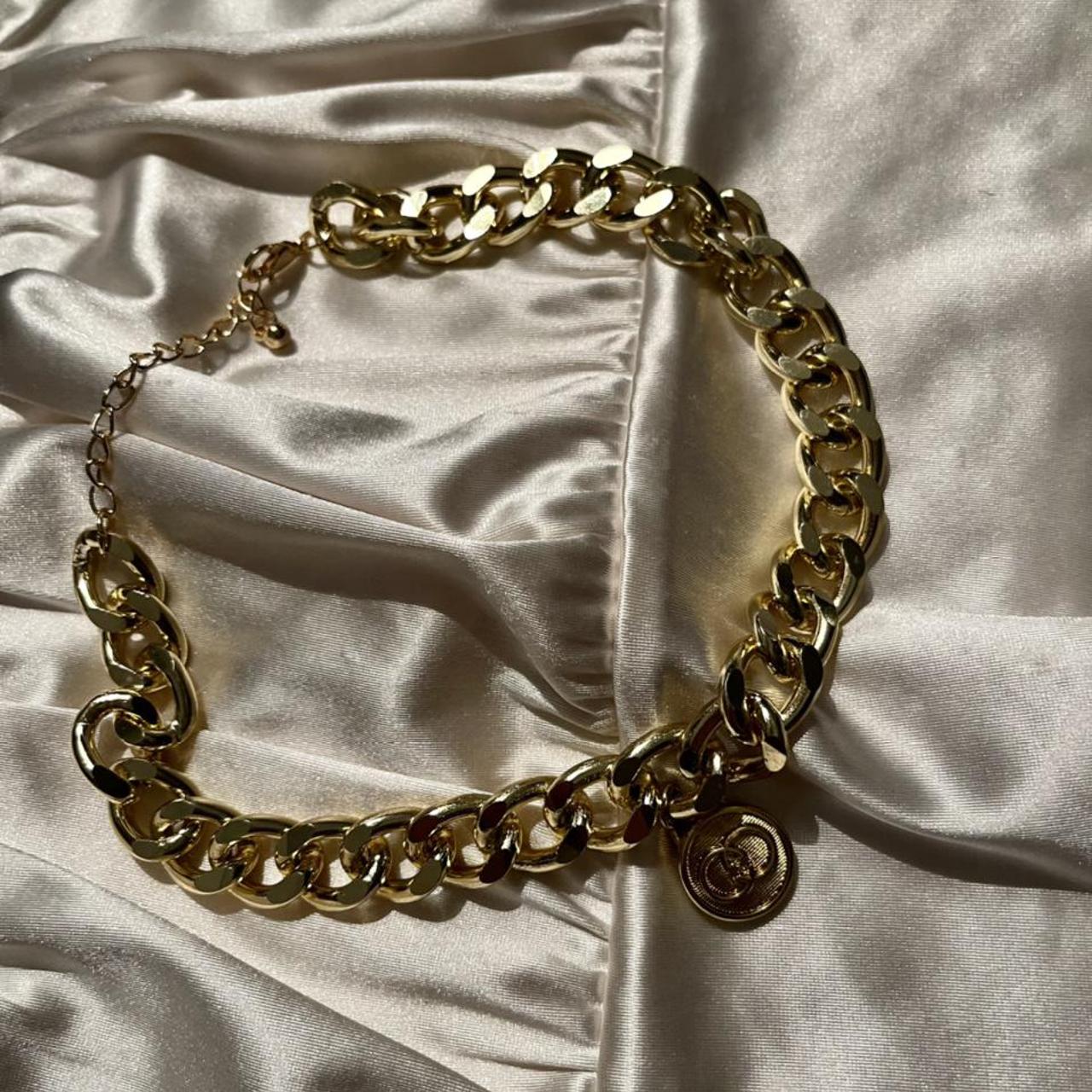 gold Gucci button repurposed into a... Depop