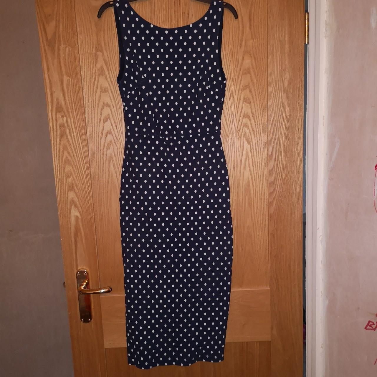 Navy and white polka dot fitted dress with low Depop