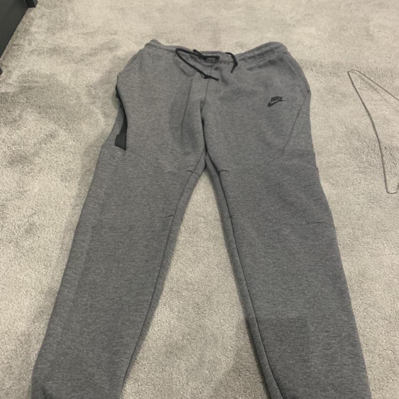 Medium Grey old season tech fleece joggers... - Depop