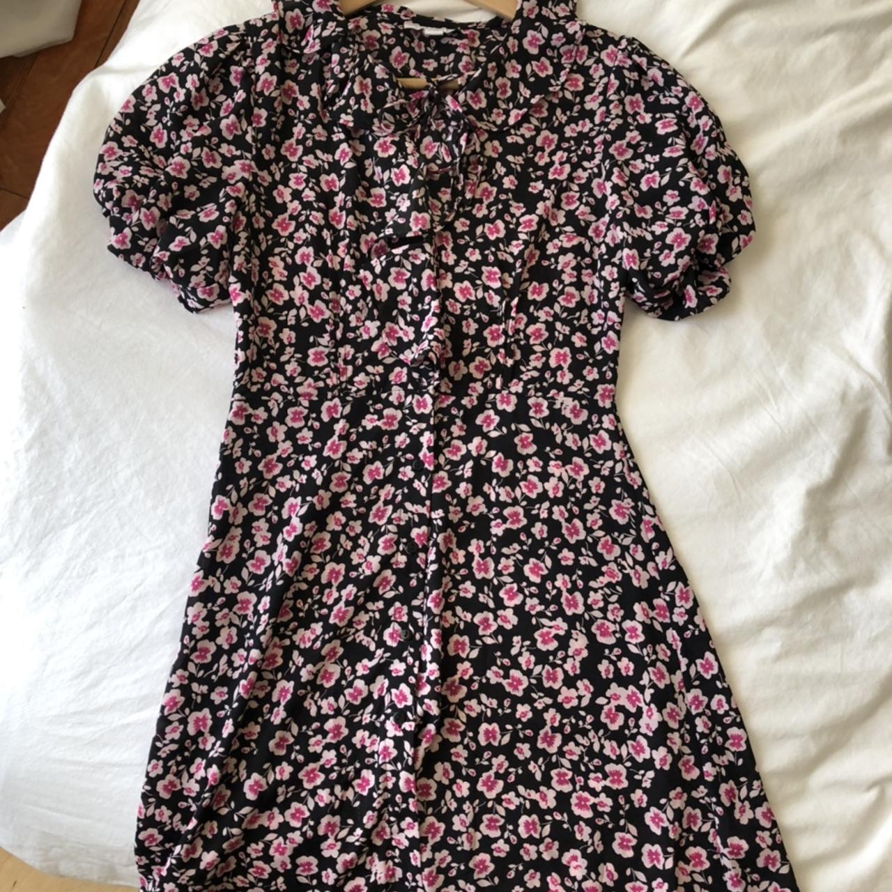 Pink and black floral babydoll style dress. Buttons... Depop