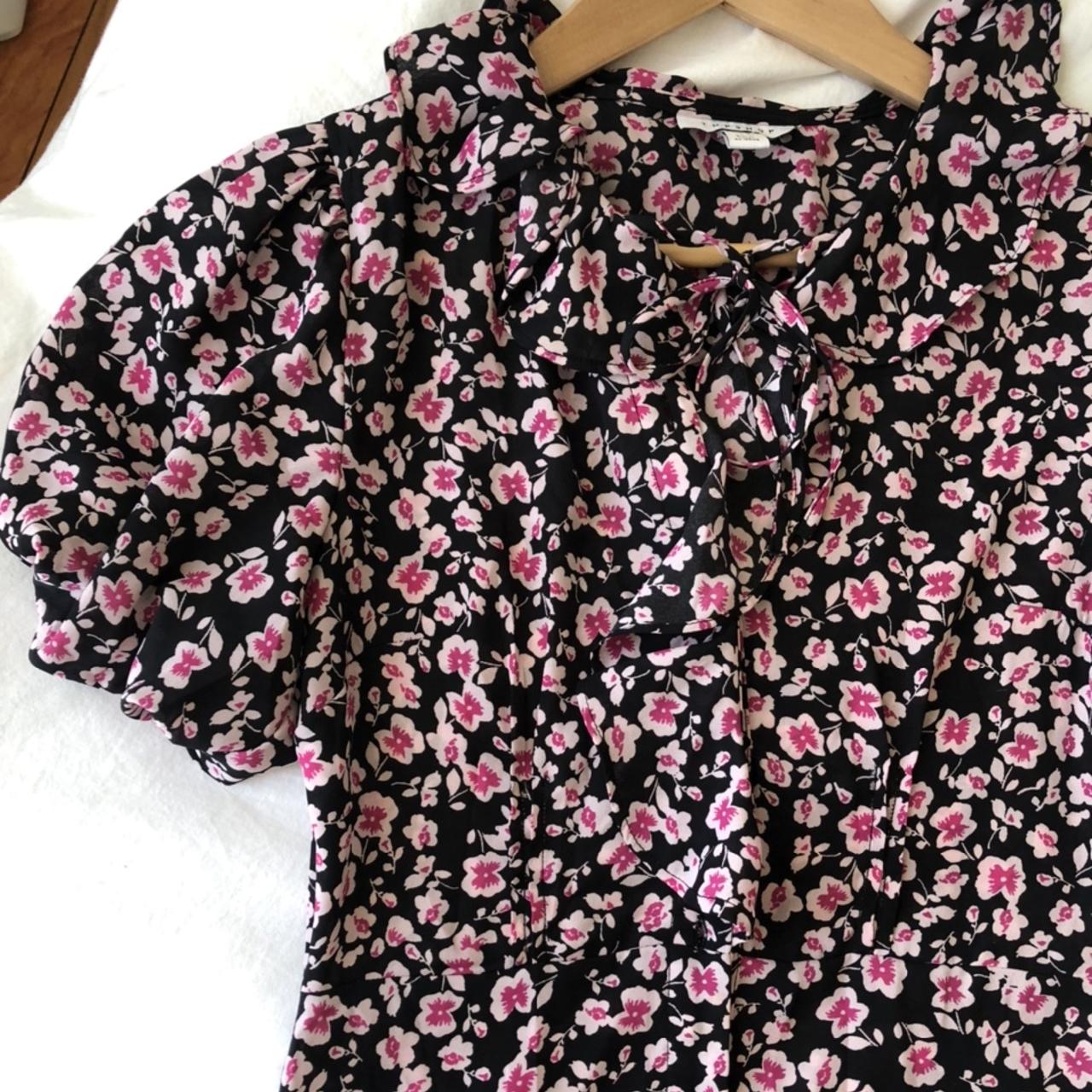 Pink and black floral babydoll style dress. Buttons... Depop