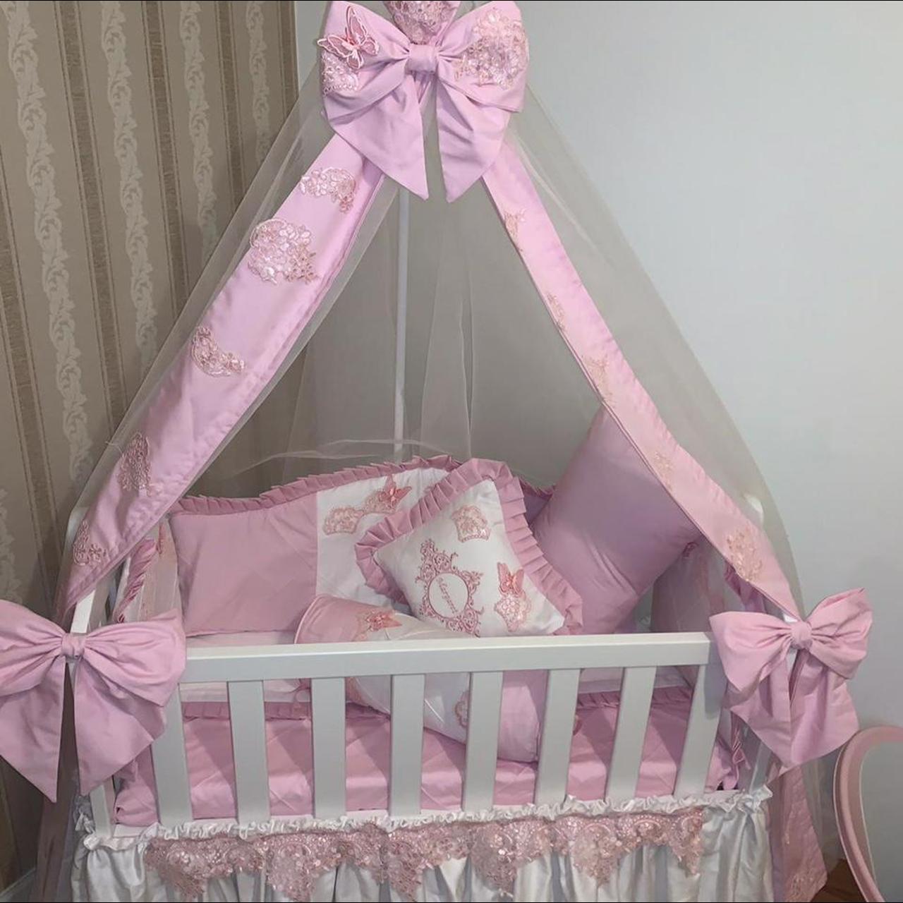 Pink swinging crib best sale