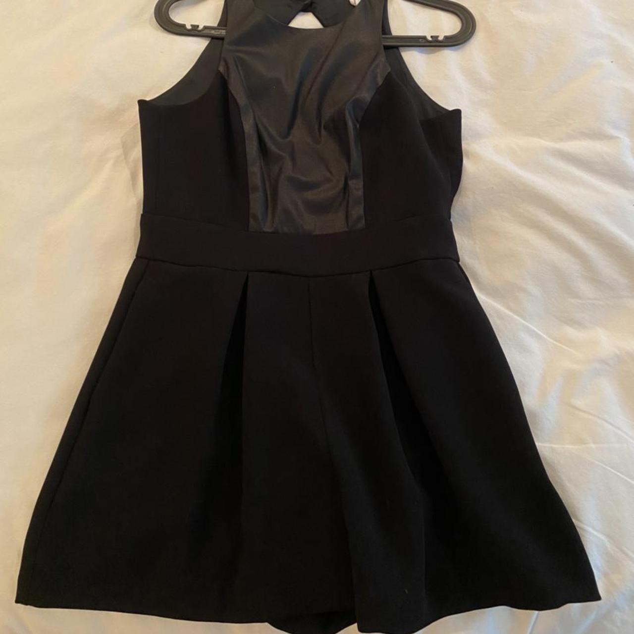 Black romper from BCBG with faux leather Depop