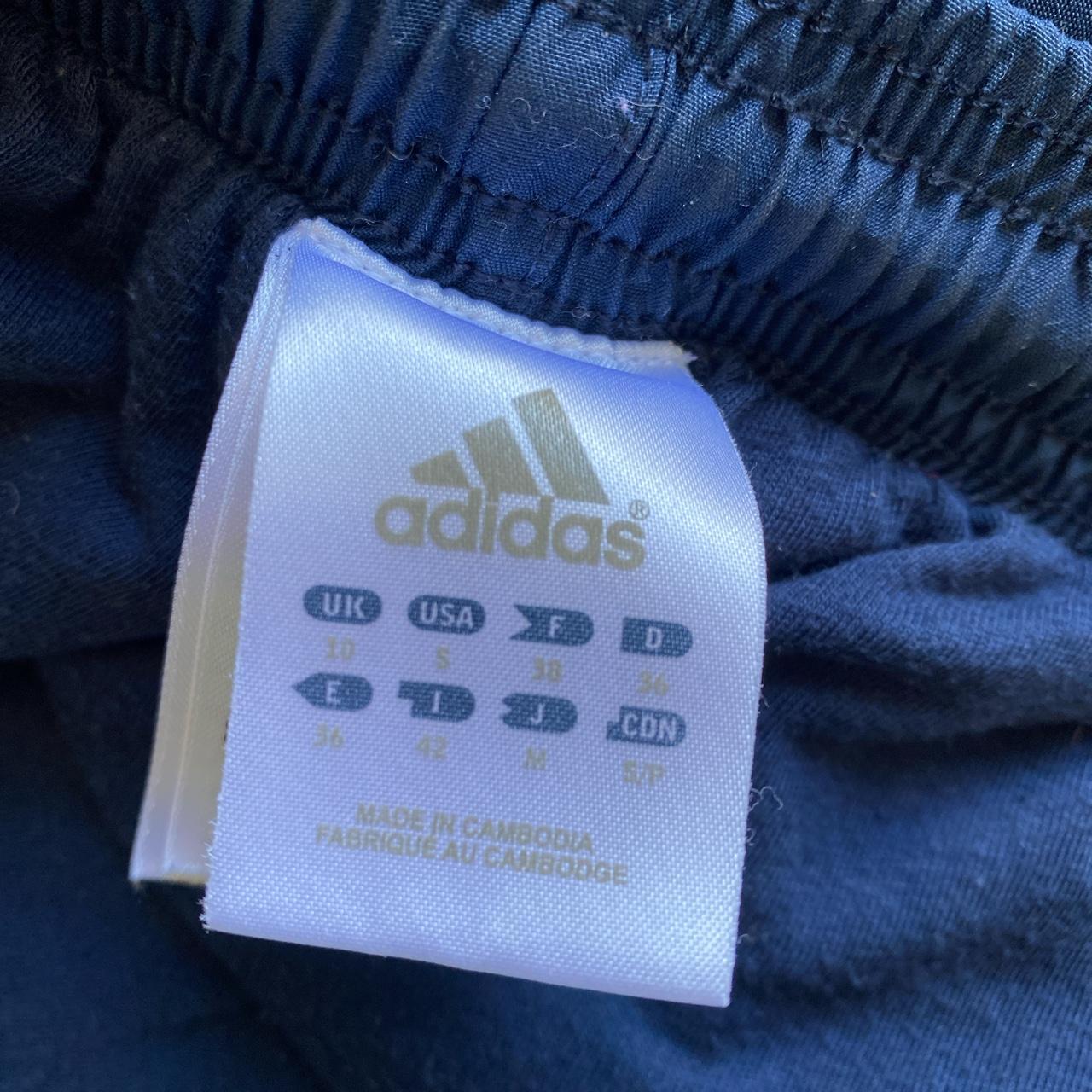 Adidas navy blue and pink striped tracksuits/joggers... - Depop