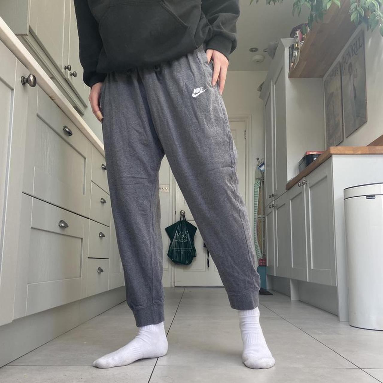 Grey Nike Joggers with adjustable drawstring waist... Depop