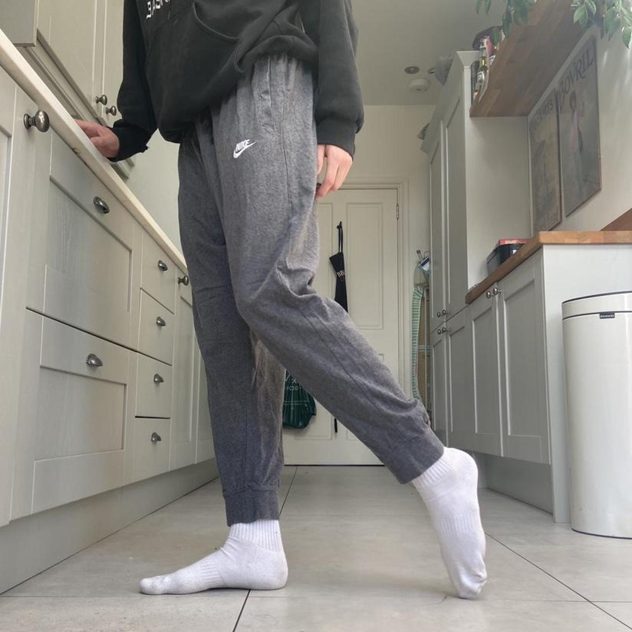 Grey Nike Joggers with adjustable drawstring waist... - Depop