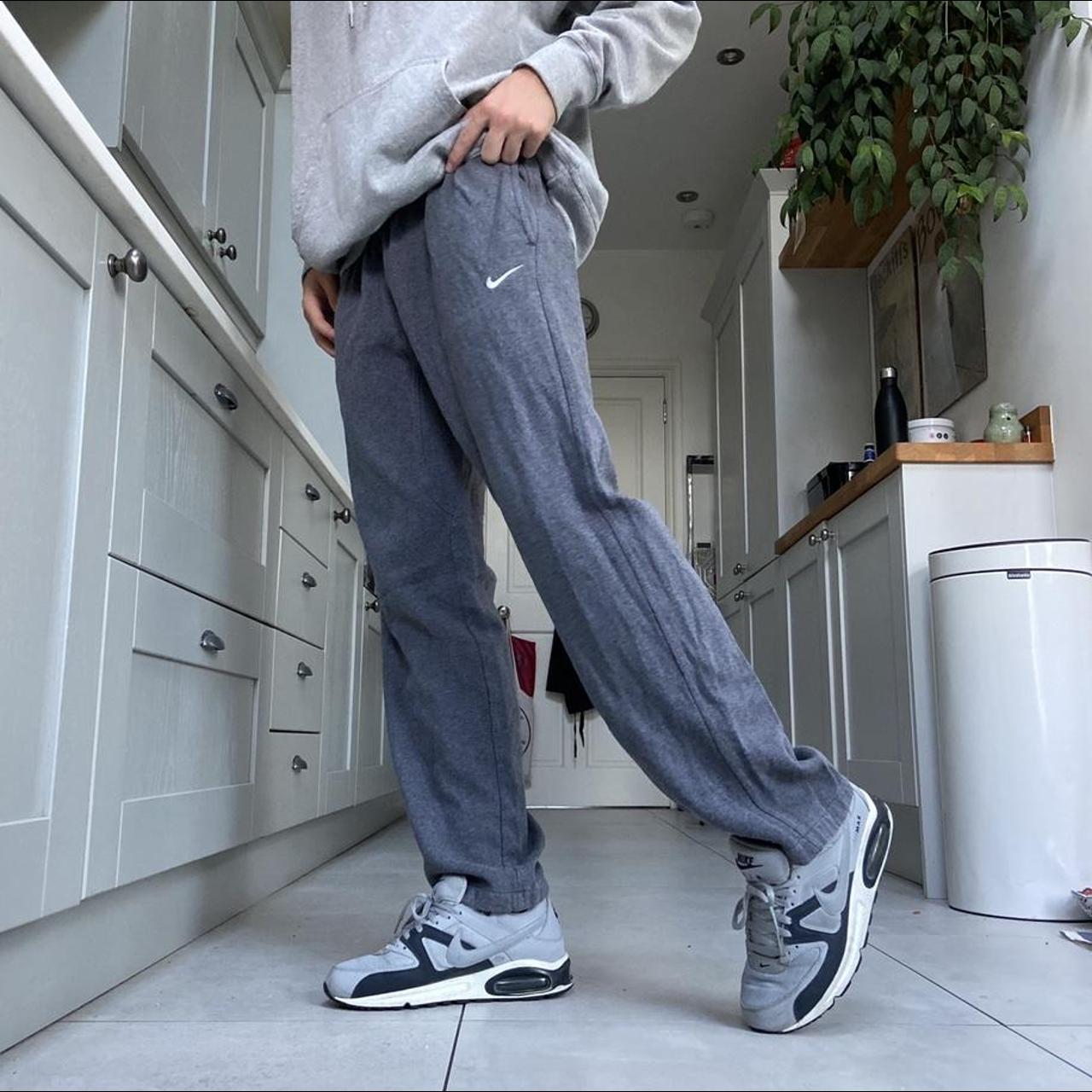 Grey Nike Joggers with adjustable drawstring waist... Depop