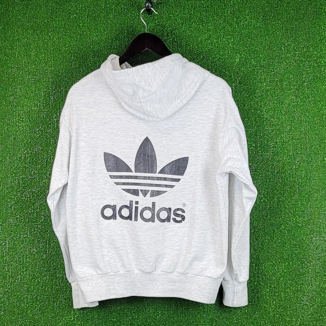 Adidas hoodie in grey with large Adidas logo... - Depop