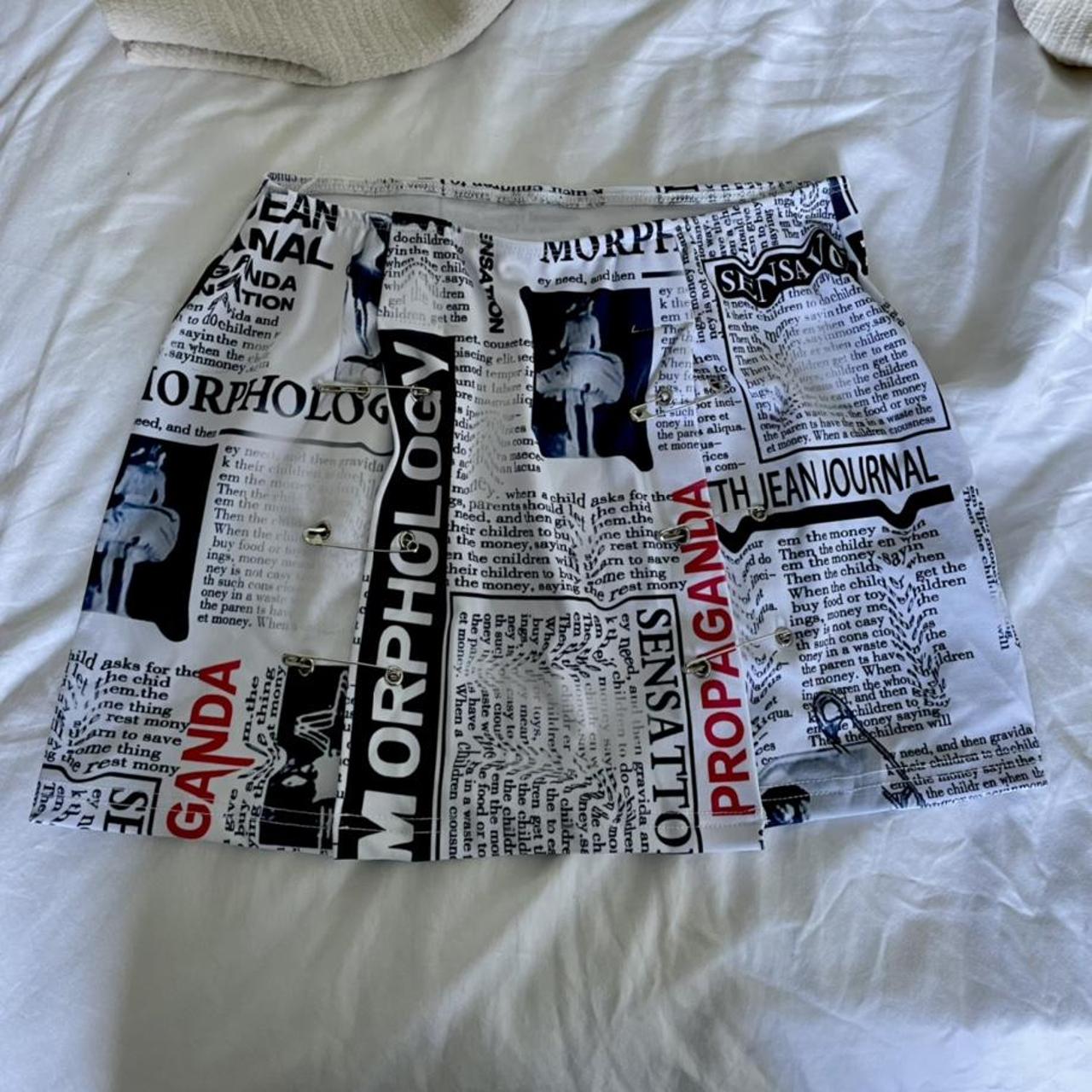 Newspaper print mini skirt with 2 slits and safety... Depop