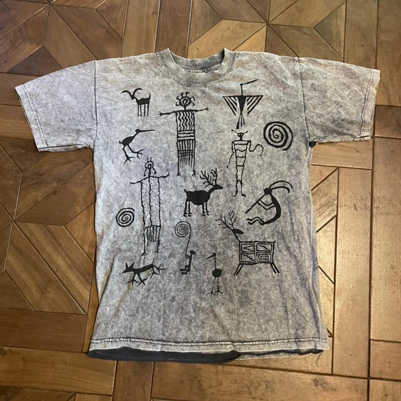 Looking for a stylish and unique tee? Check out this - Depop