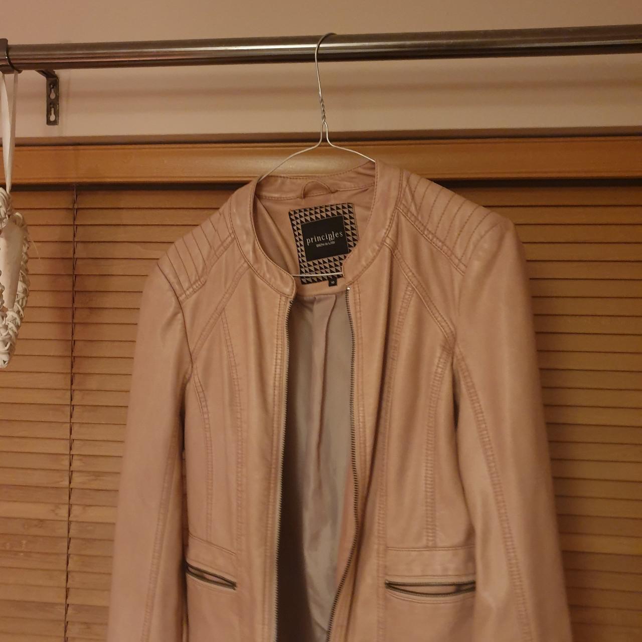 This is a beautiful dusky pink short biker jacket