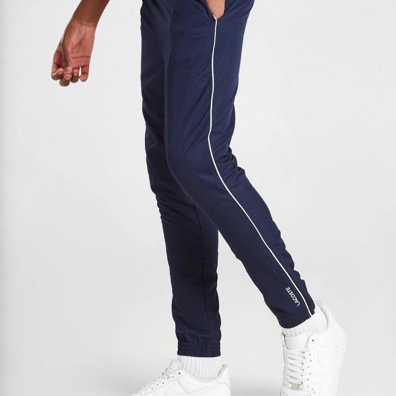 Lacoste Guppy Track Pants. Navy tracksuit bottoms... Depop