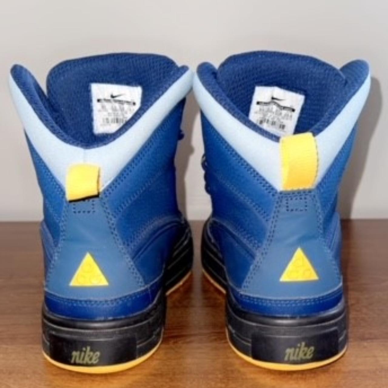 navy blue and yellow nike shoes
