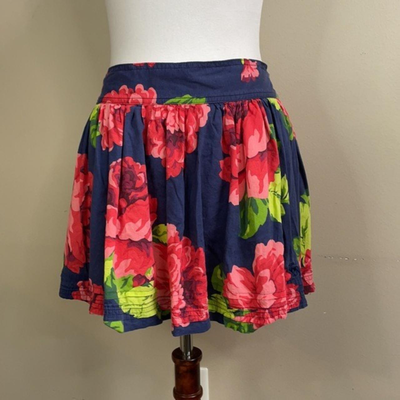 Navy blue mini skirt with red and green floral... - Depop
