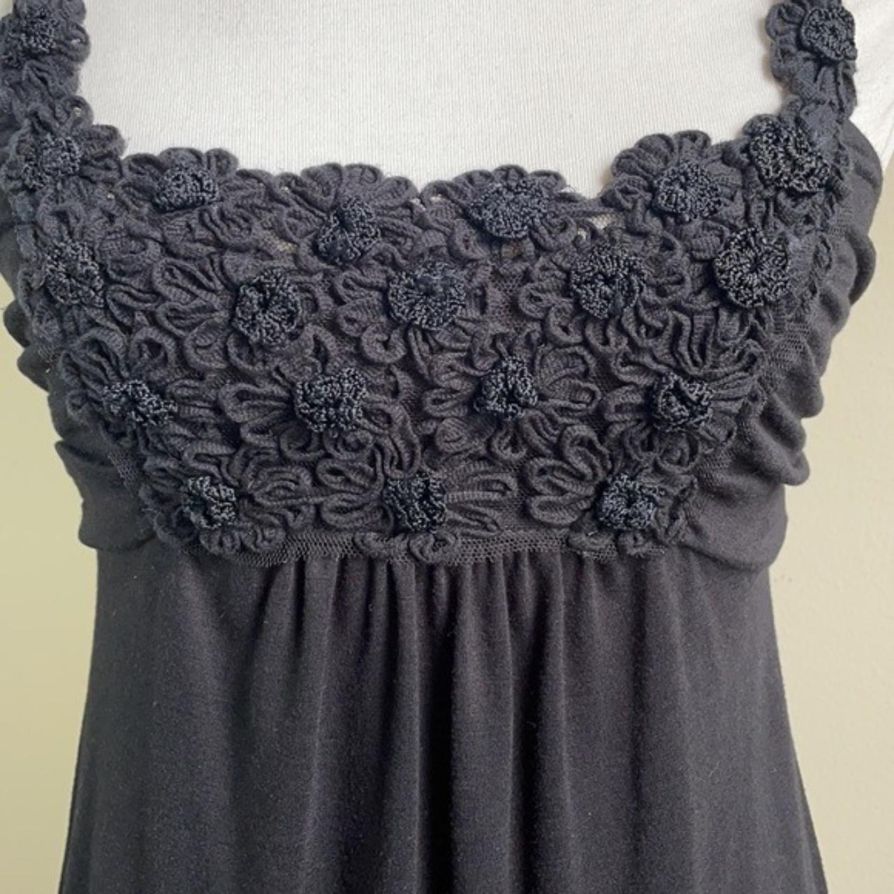 Black babydoll dress with floral designs on the... Depop