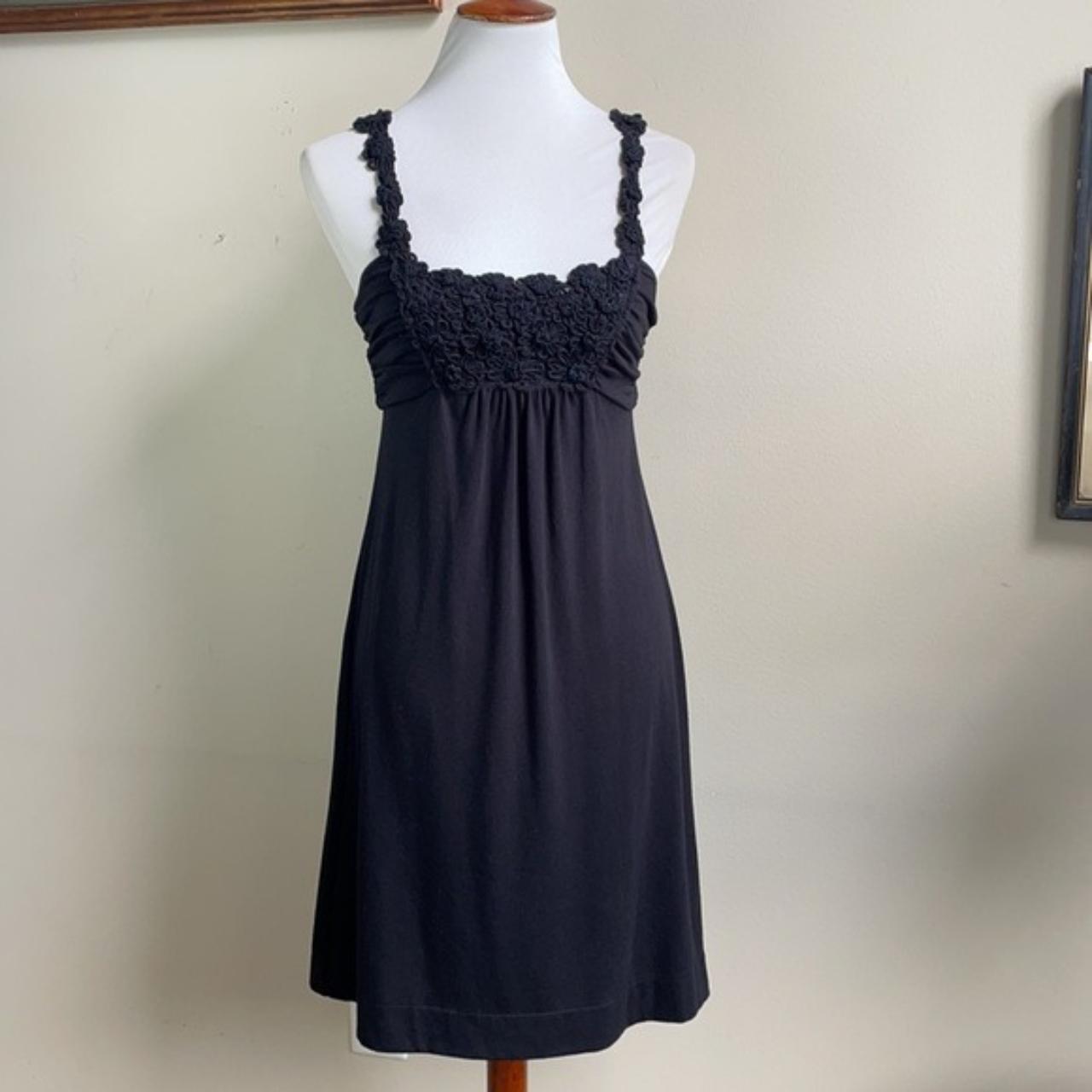 Black babydoll dress with floral designs on the... Depop
