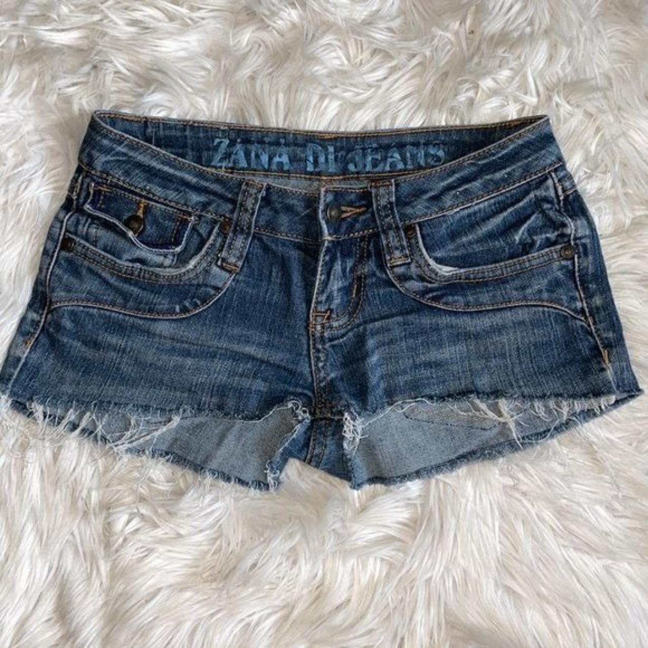 Dark wash cutoff denim shorts with fringe on the... - Depop