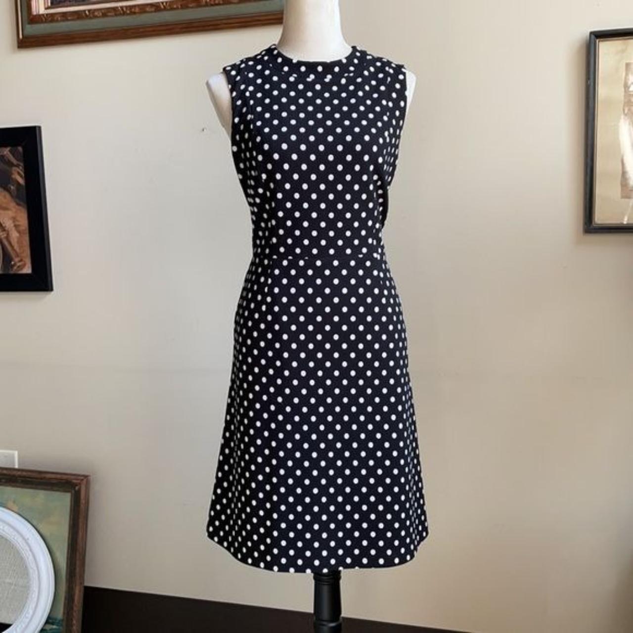 The black dress had white polka dots throughout the... - Depop