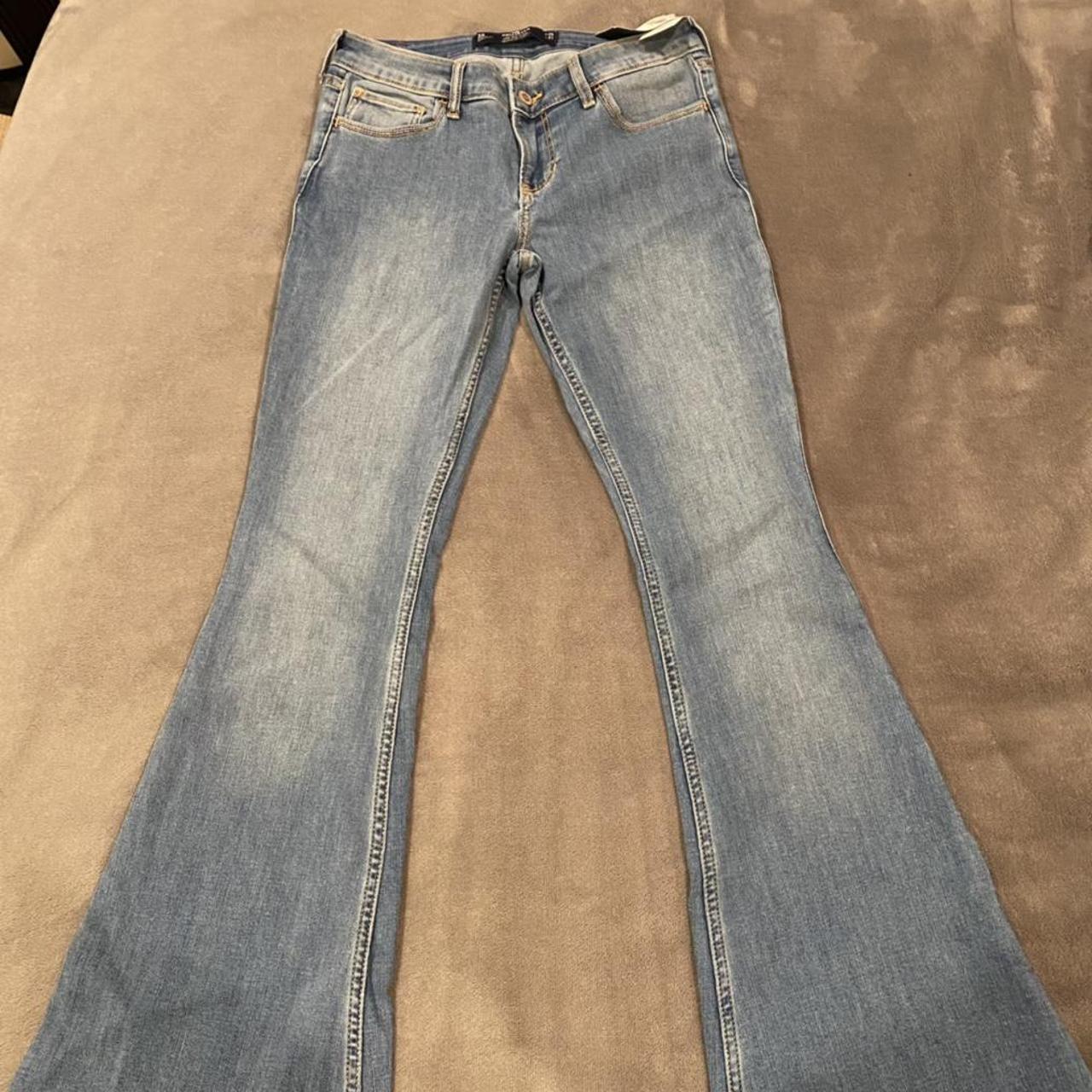 Hollister low rise flare jeans - medium wash. Never... - Depop