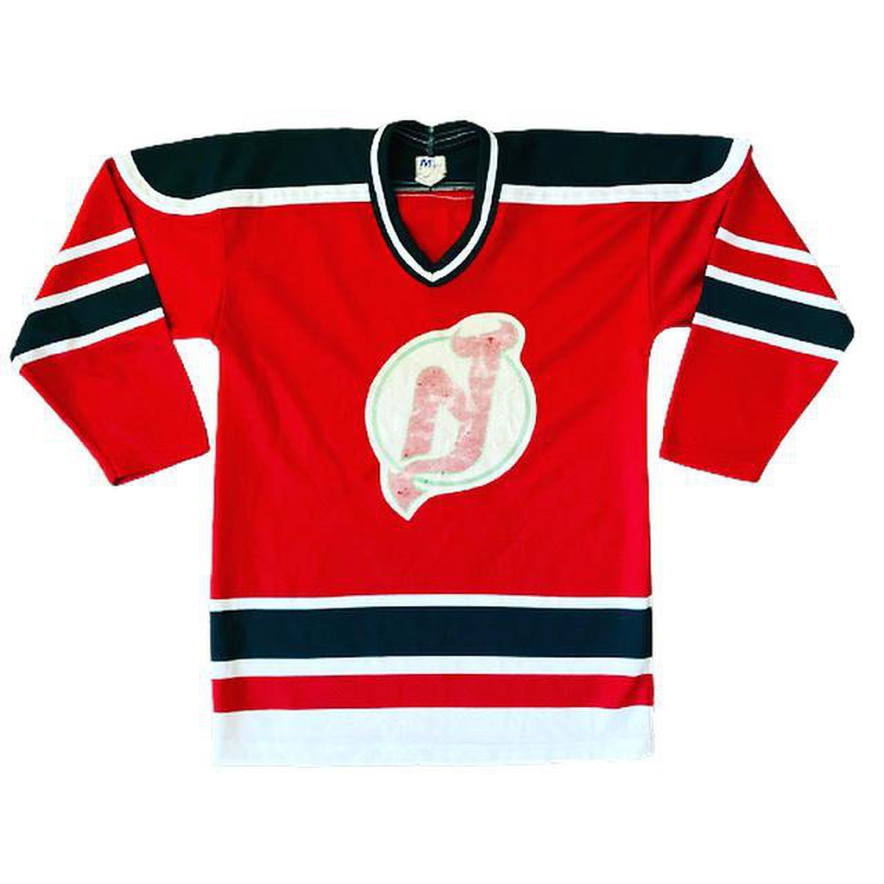 Vintage sports jersey in red with contrasting white... Depop