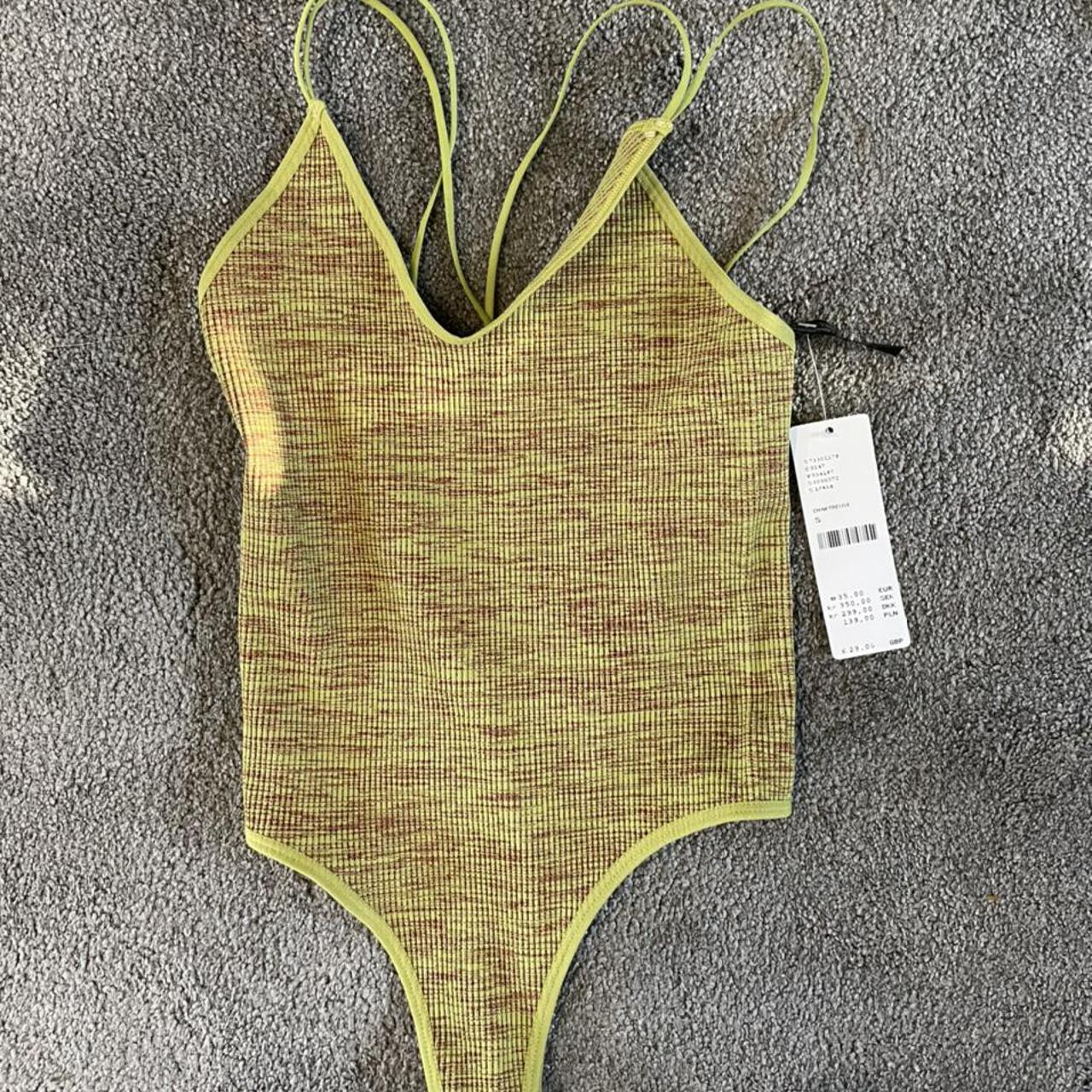 Urban outfitters strappy back thong bodysuit size S.... Depop