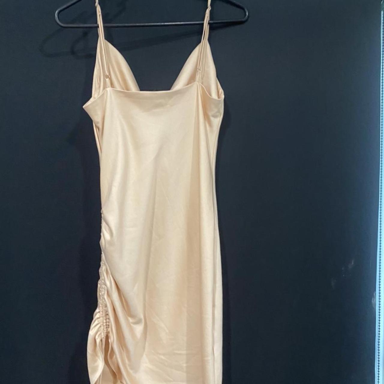 Light pink mini dress with ruching on the side.... - Depop