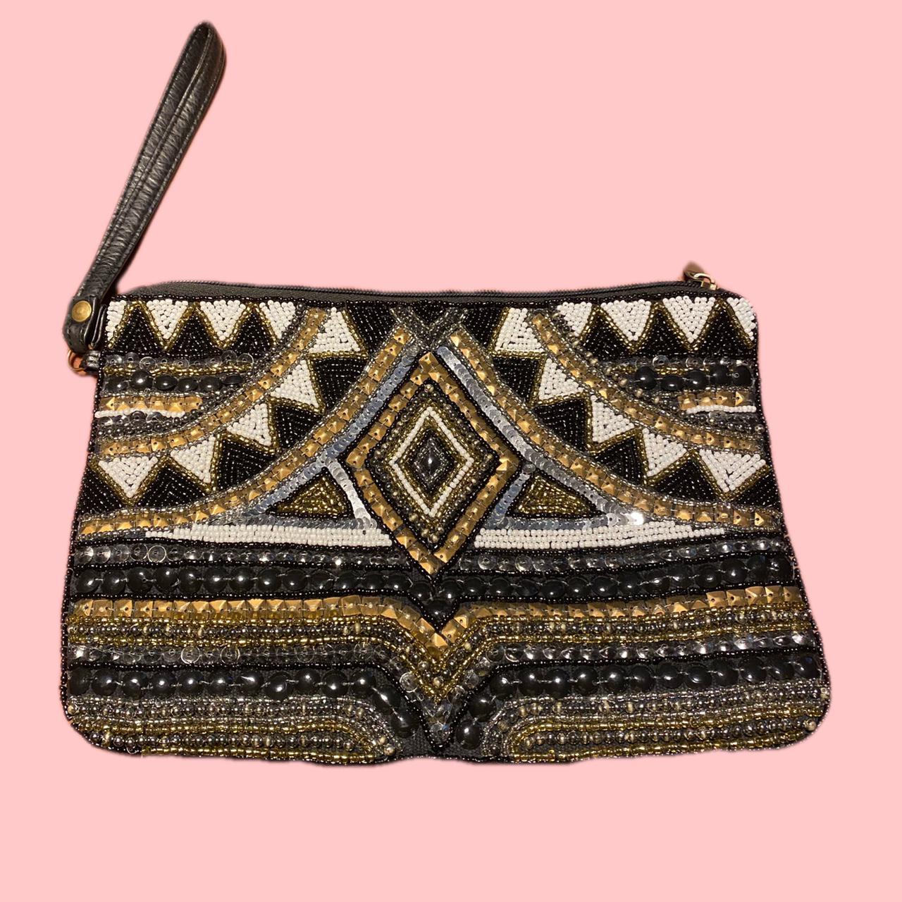 Clutch bag with wrist strap, beaded on one side with... Depop