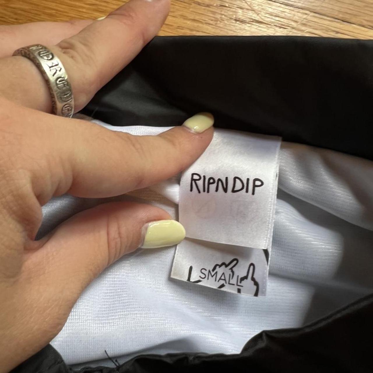 Rip N Dip alien black raincoat/wind breaker jacket.... Depop