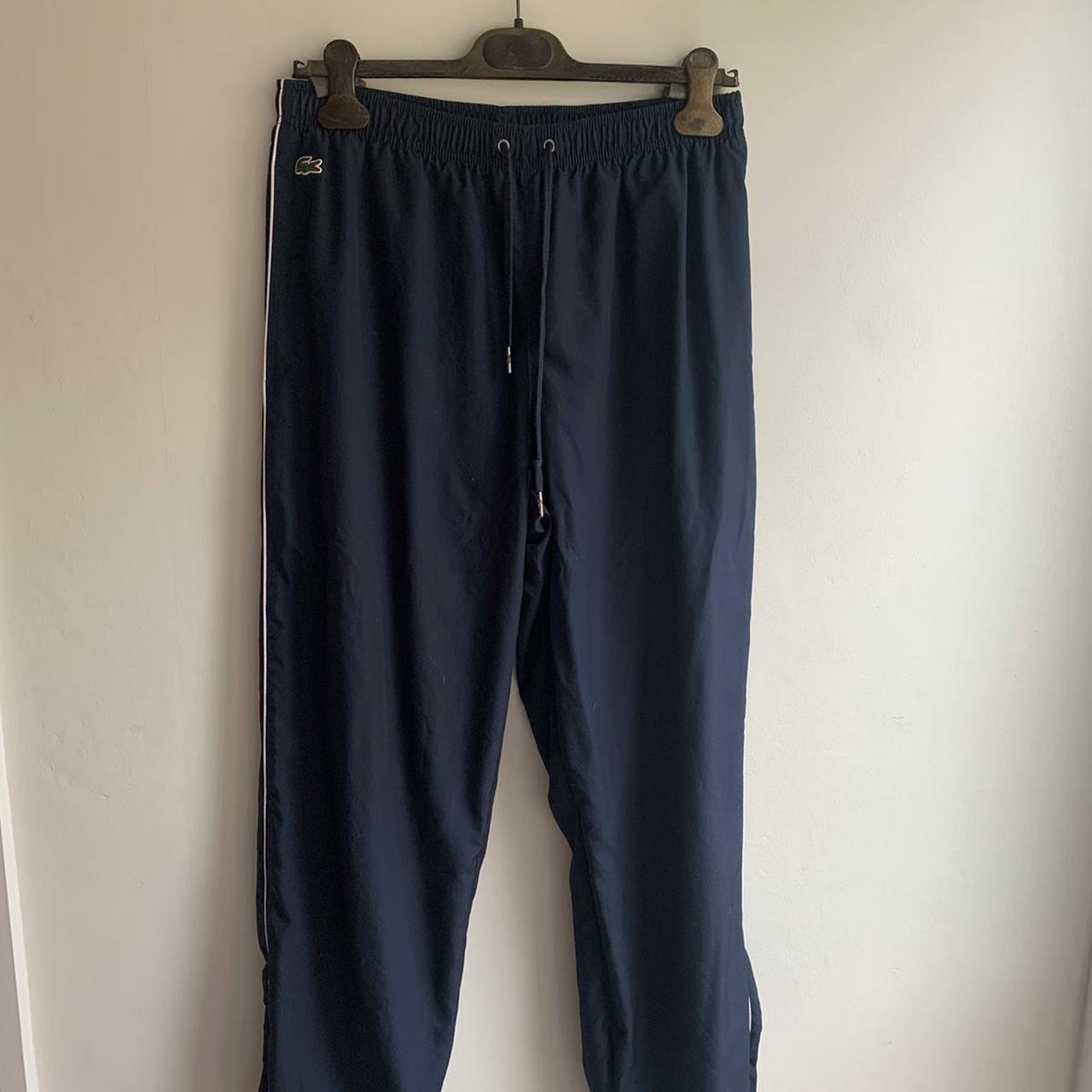 LACOSTE TRACKPANTS WITH ZIP AT SIDES IN NAVY WITH... - Depop