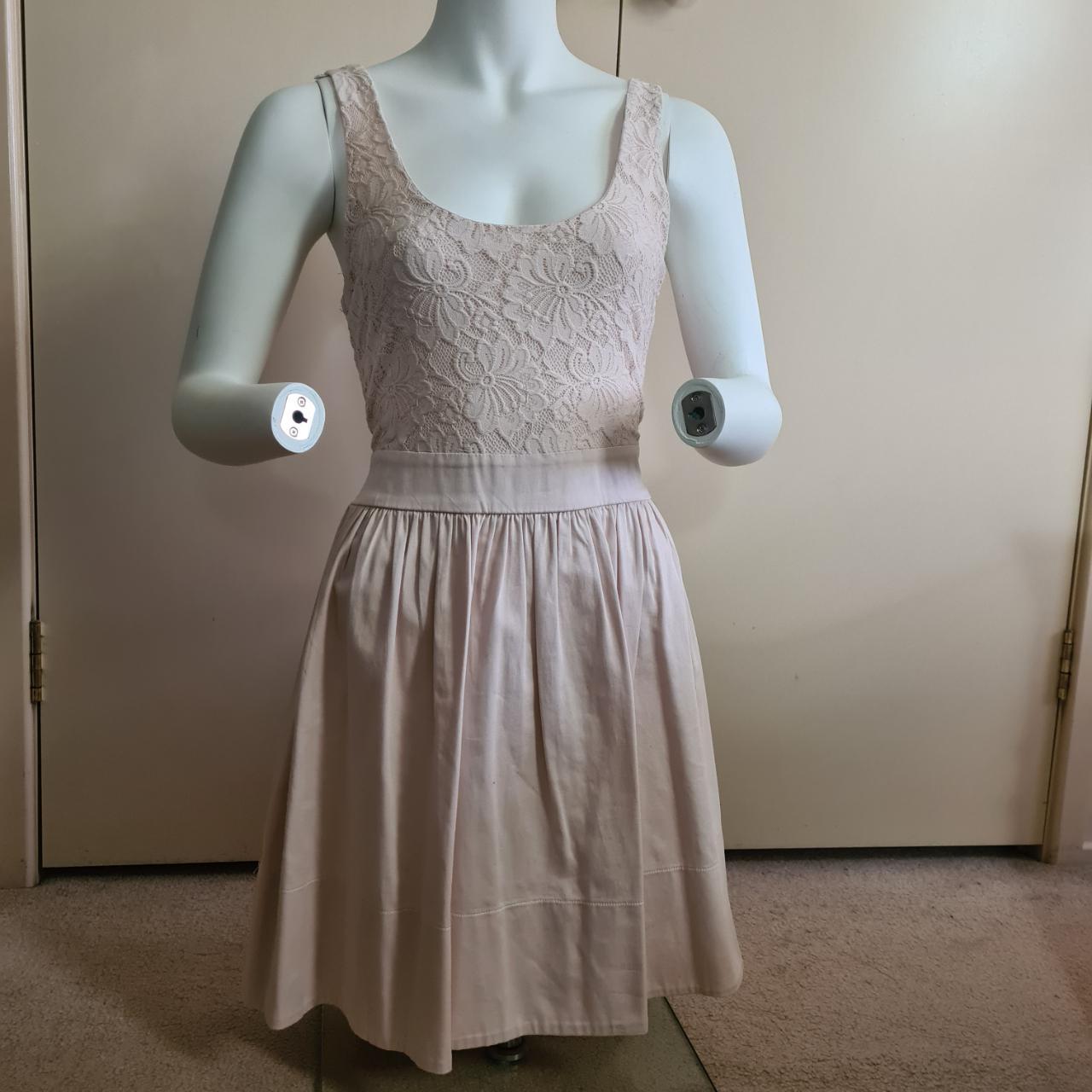  Short, cream/blush dress with cute lace detail on... Depop