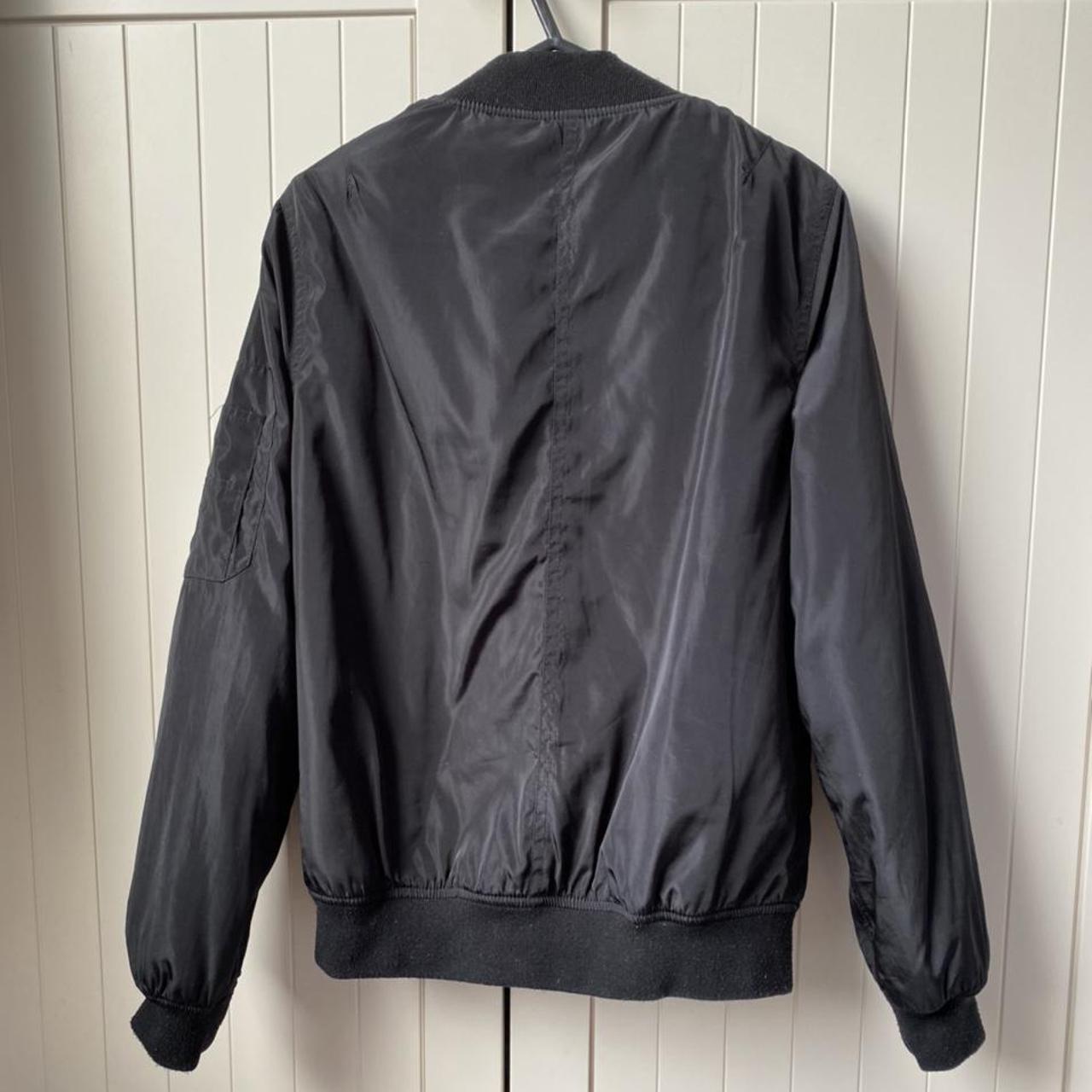 Black bomber jacket with orange lining. UK Size... - Depop
