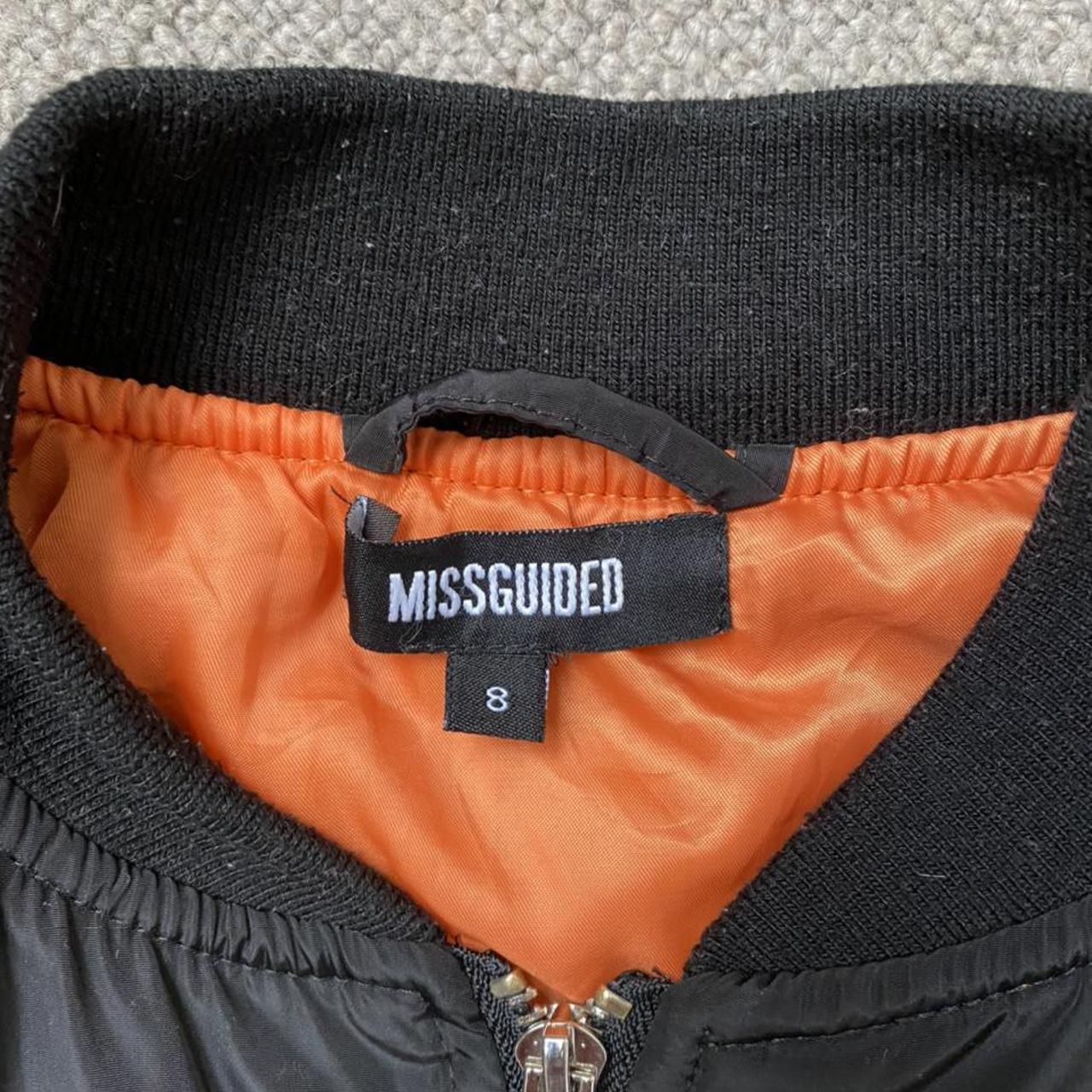 Black bomber jacket with orange lining. UK Size... Depop