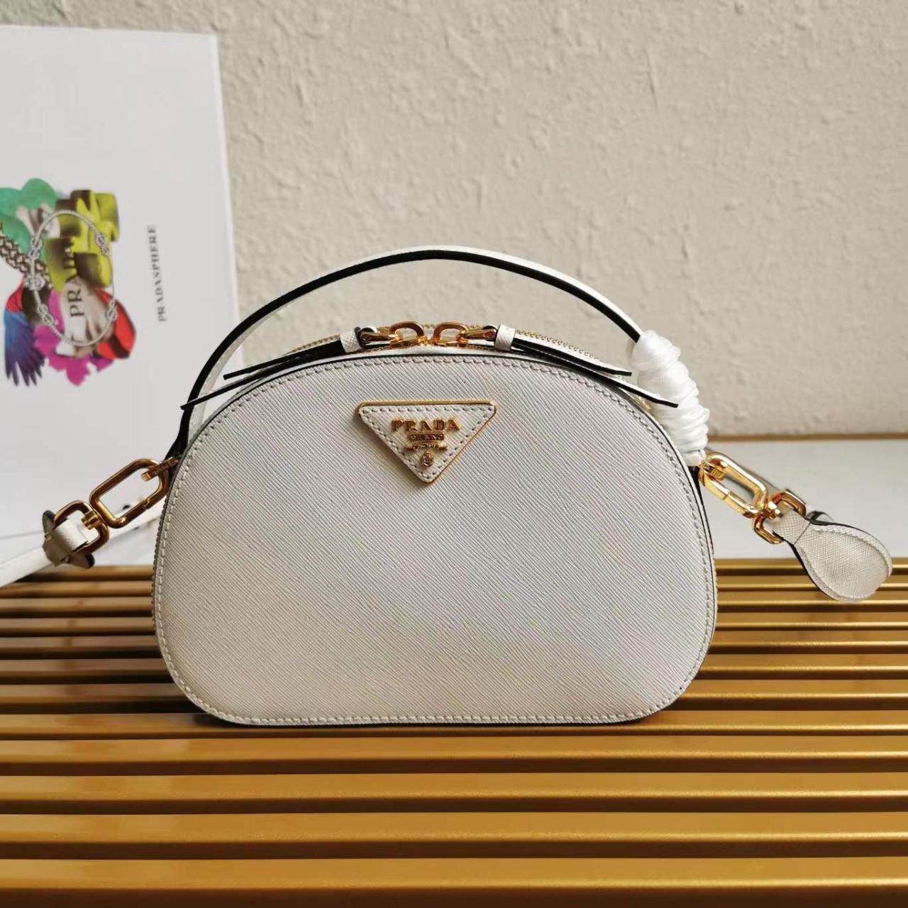 Prada shoulder bag, size 21x14x6cm, made of... Depop