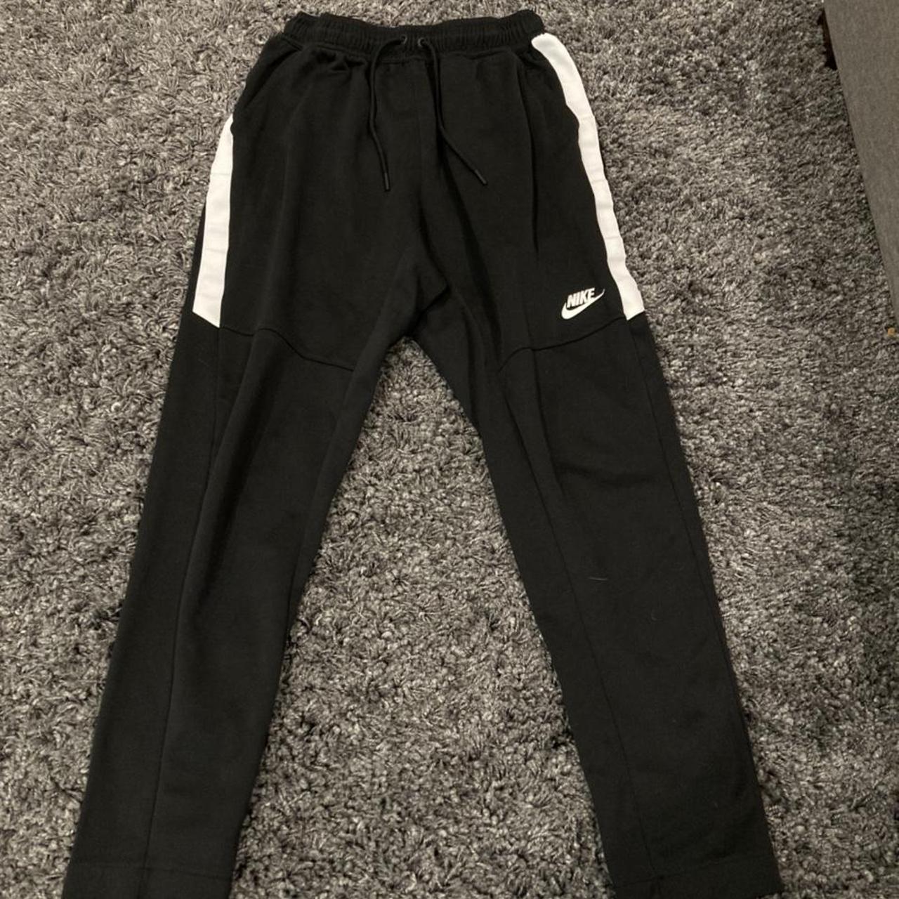 Nike sweatpants black with white stripe. Size medium... - Depop