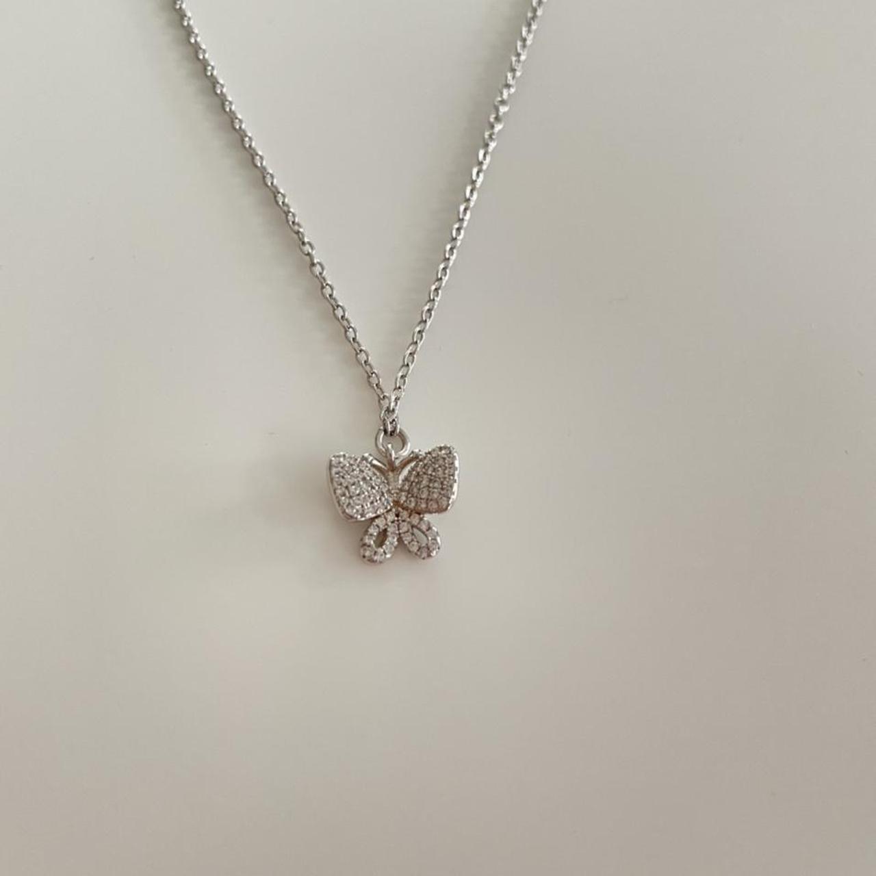 Folli follie butterfly necklace. Never worn and in