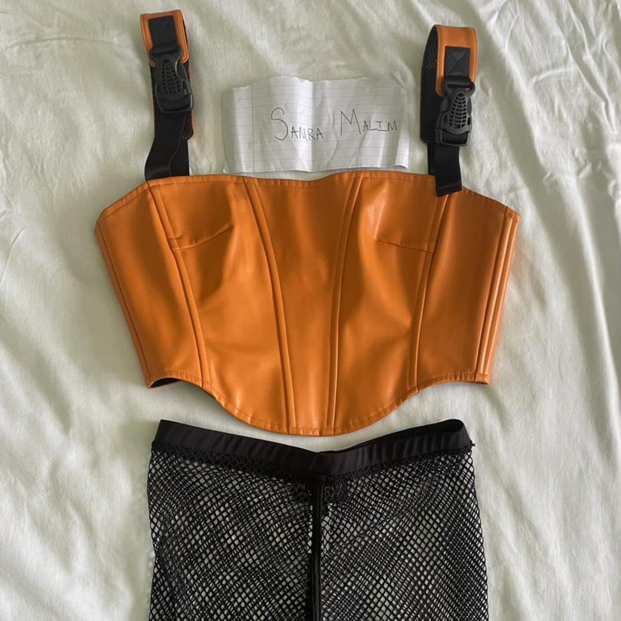 Orange corset top, throwing in the mesh shorts for... Depop