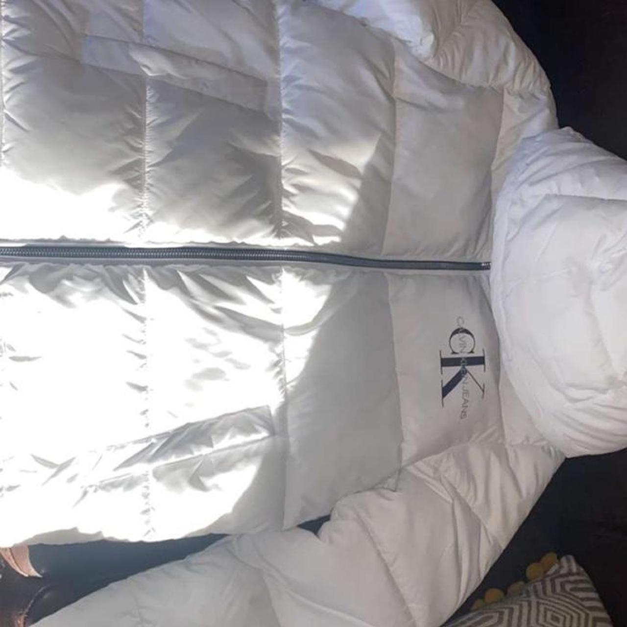 white calvin klien puffer age 14 but would fit... Depop