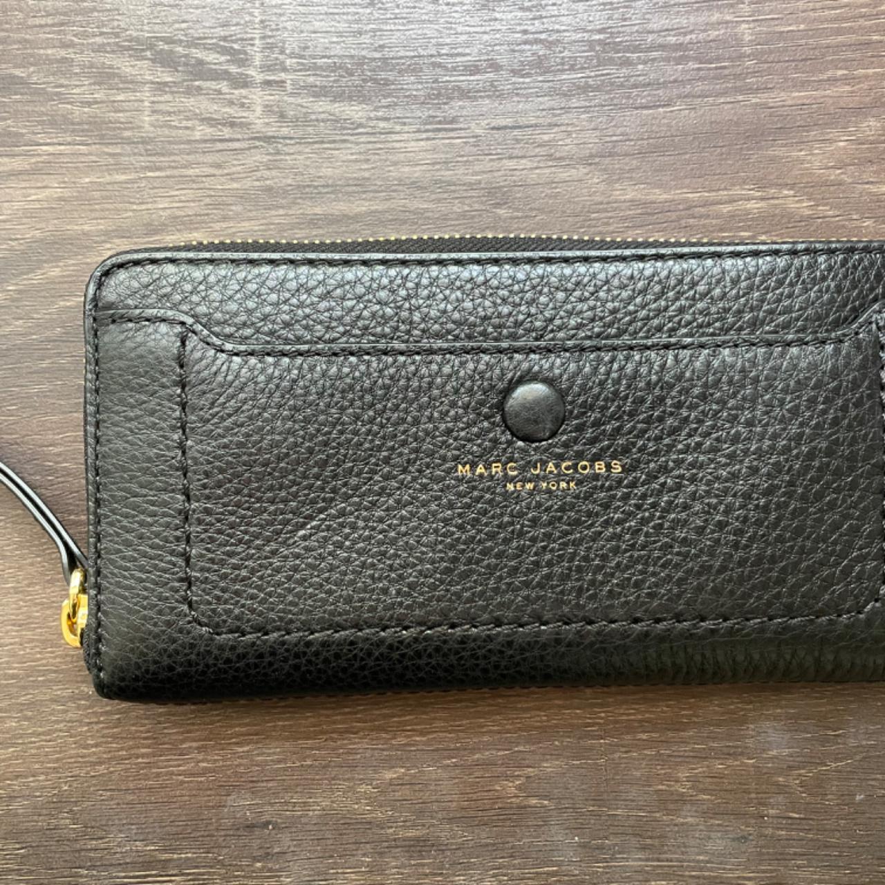 Spacious women's black wallet with gold zipper