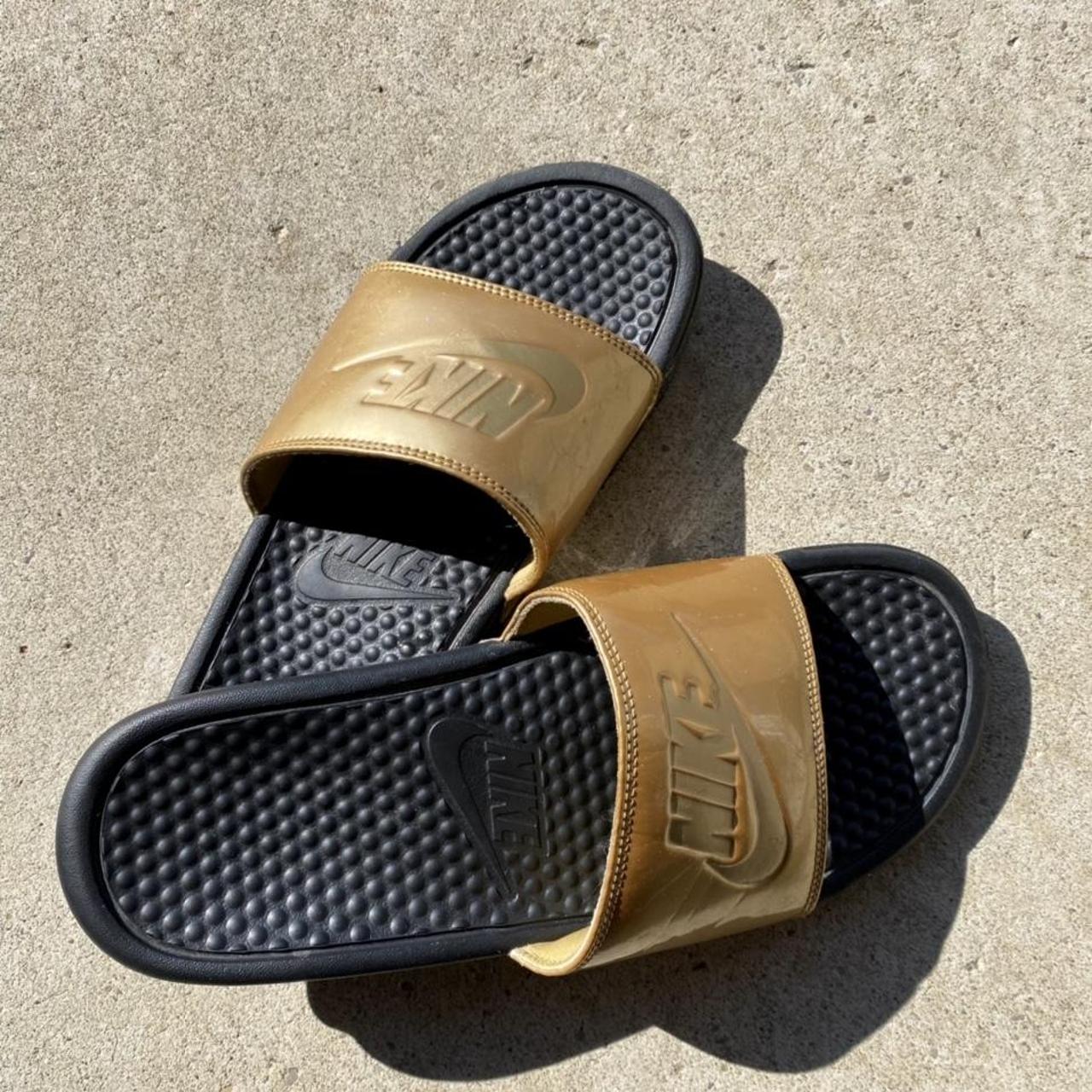 nike black and gold sliders