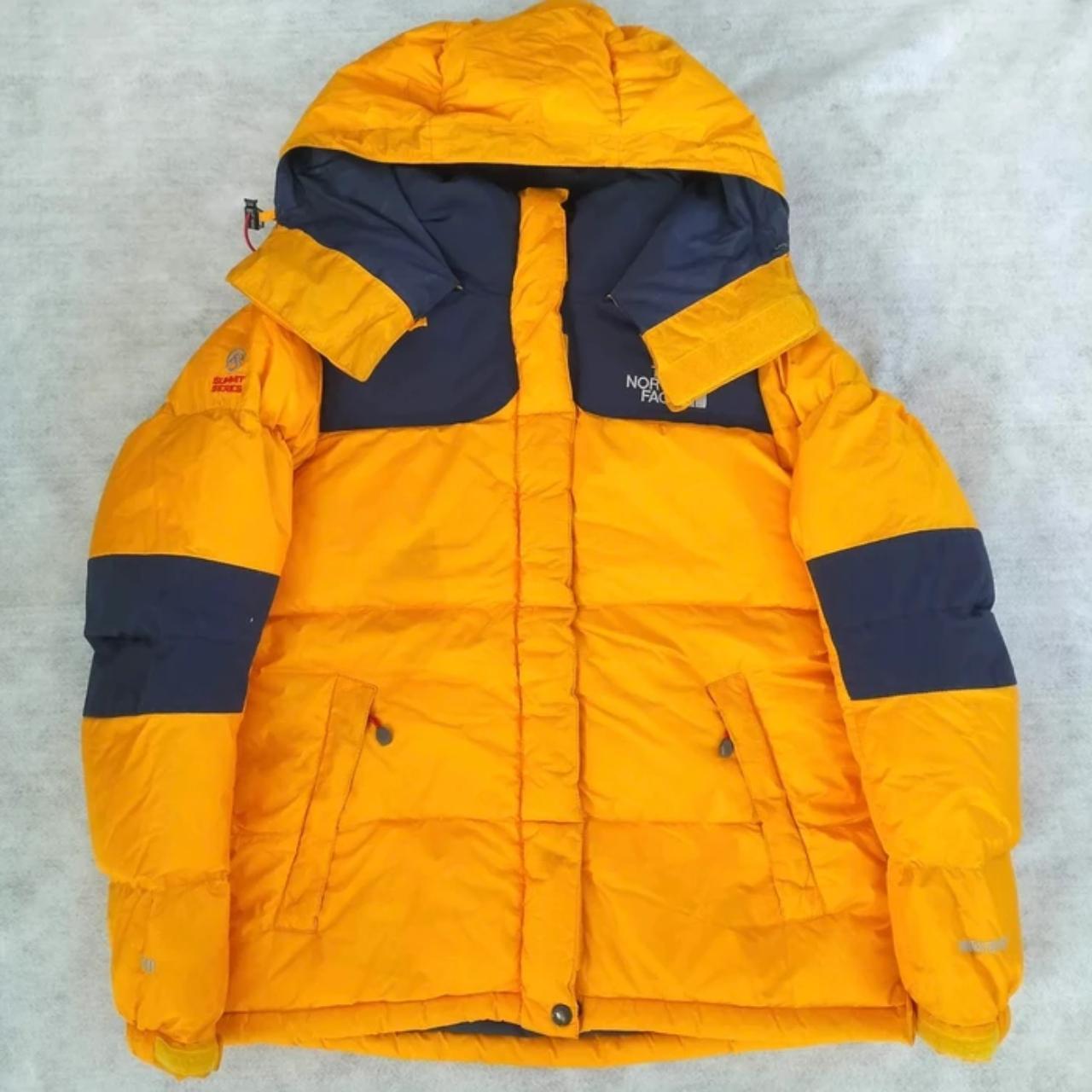 orange north face puffer
