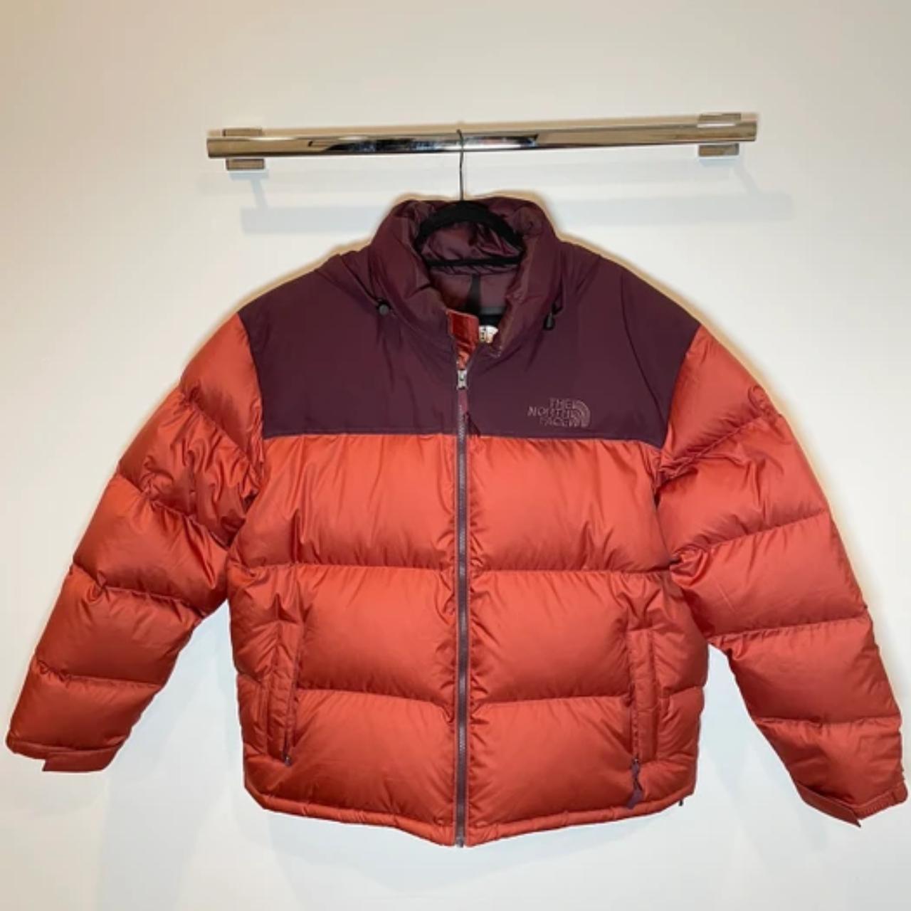orange north face puffer