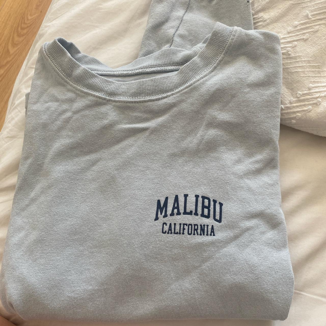 Brandy Melville loose baby blue Malibu sweatshirt... Depop