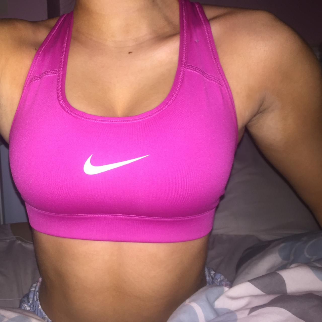 Hot pink Nike sports bra size S. Used, but good - Depop